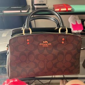 Coach brown and black handbag.